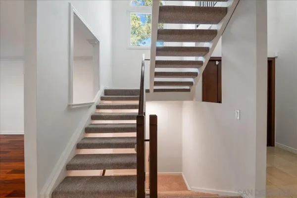 a view of staircase with white walls