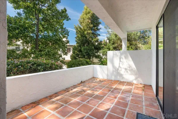 a view of balcony with wooden floor