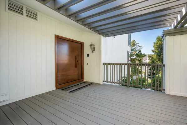 a view of a porch with wooden floor