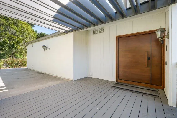 a view of front door and wooden floor