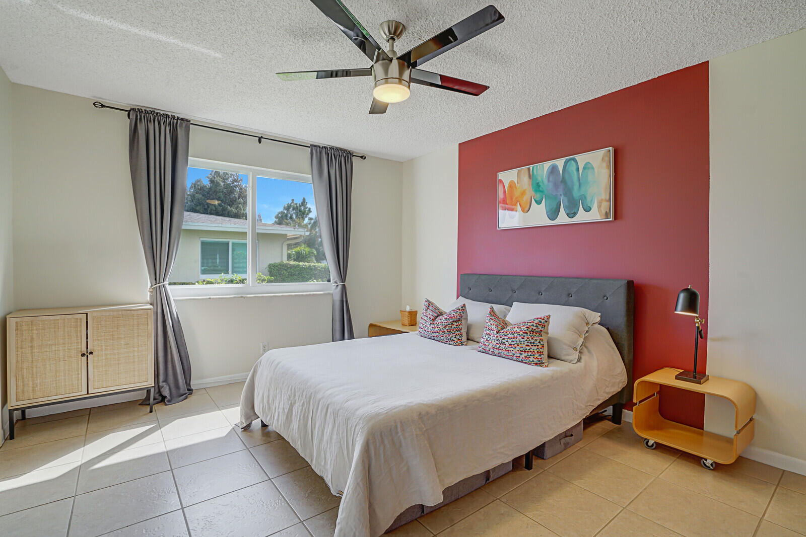 202 West High Point Terrace, Unit A Delray Beach, FL 33445 - Photo 18 of 55 a bedroom with a bed and a window