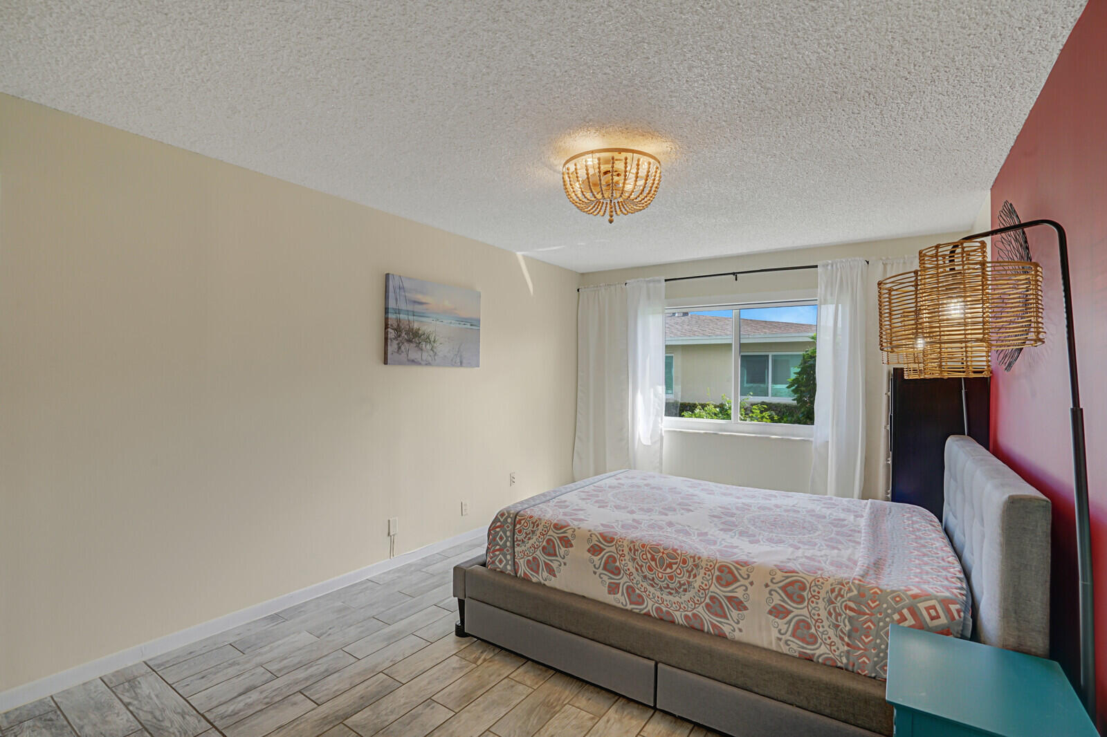 202 West High Point Terrace, Unit A Delray Beach, FL 33445 - Photo 21 of 55 a bedroom with a bed and a window