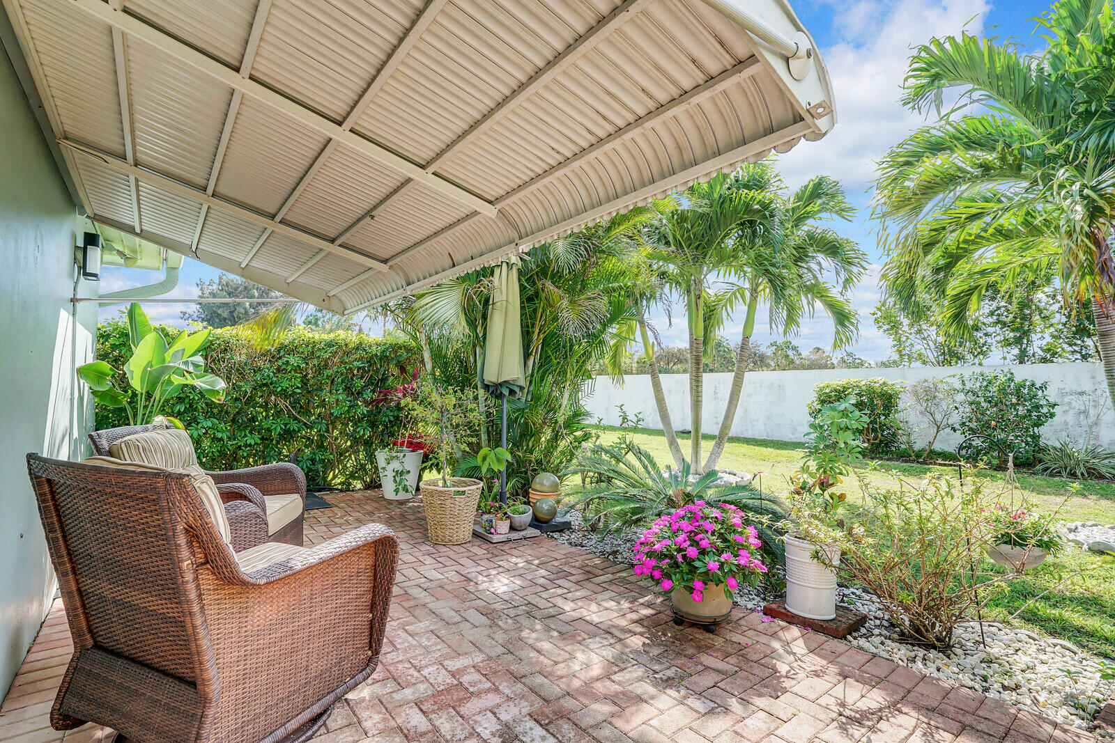 202 West High Point Terrace, Unit A Delray Beach, FL 33445 - Photo 24 of 55 a garden view with a seating space