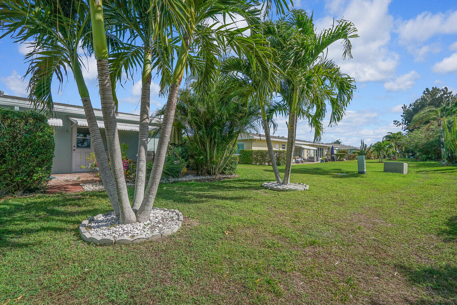 202 West High Point Terrace, Unit A Delray Beach, FL 33445 - Photo 28 of 55 a garden with palm trees