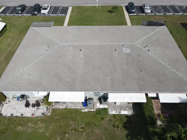 an aerial view of residential houses and outdoor space