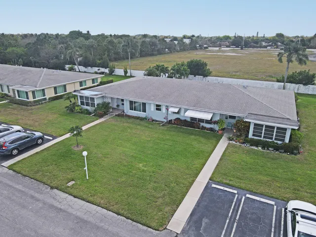 an aerial view of residential house with outdoor space
