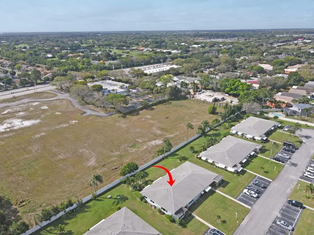 an aerial view of house with yard swimming pool and outdoor seating