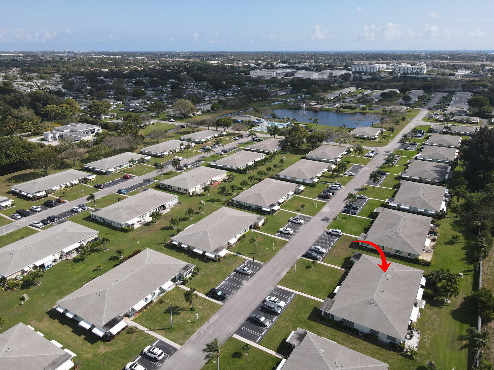 202 West High Point Terrace, Unit A Delray Beach, FL 33445 - Photo 42 of 55 an aerial view of a city with lots of residential buildings ocean and mountain view in back