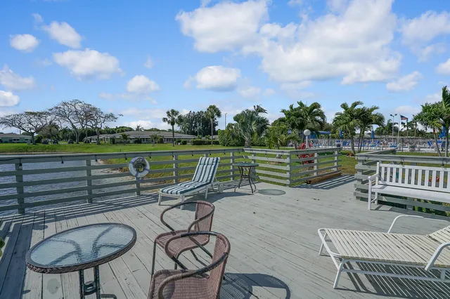 a view of a lake with houses in the back
