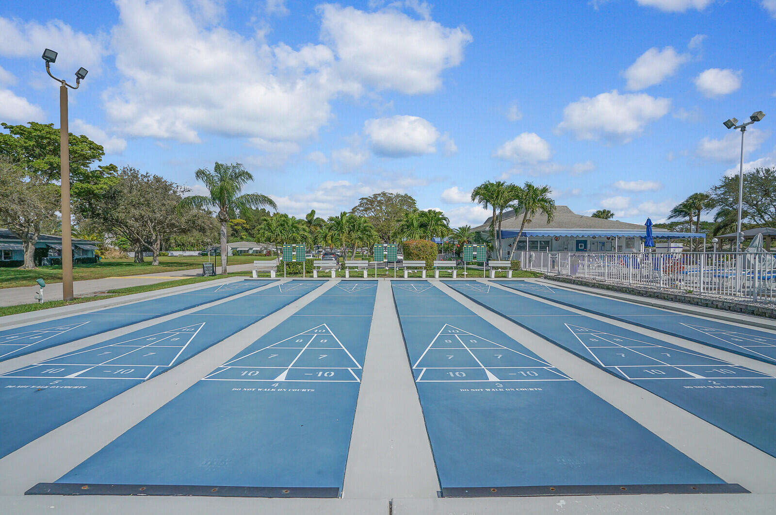 202 West High Point Terrace, Unit A Delray Beach, FL 33445 - Photo 49 of 55 a view of a swimming pool with an outdoor space and seating area