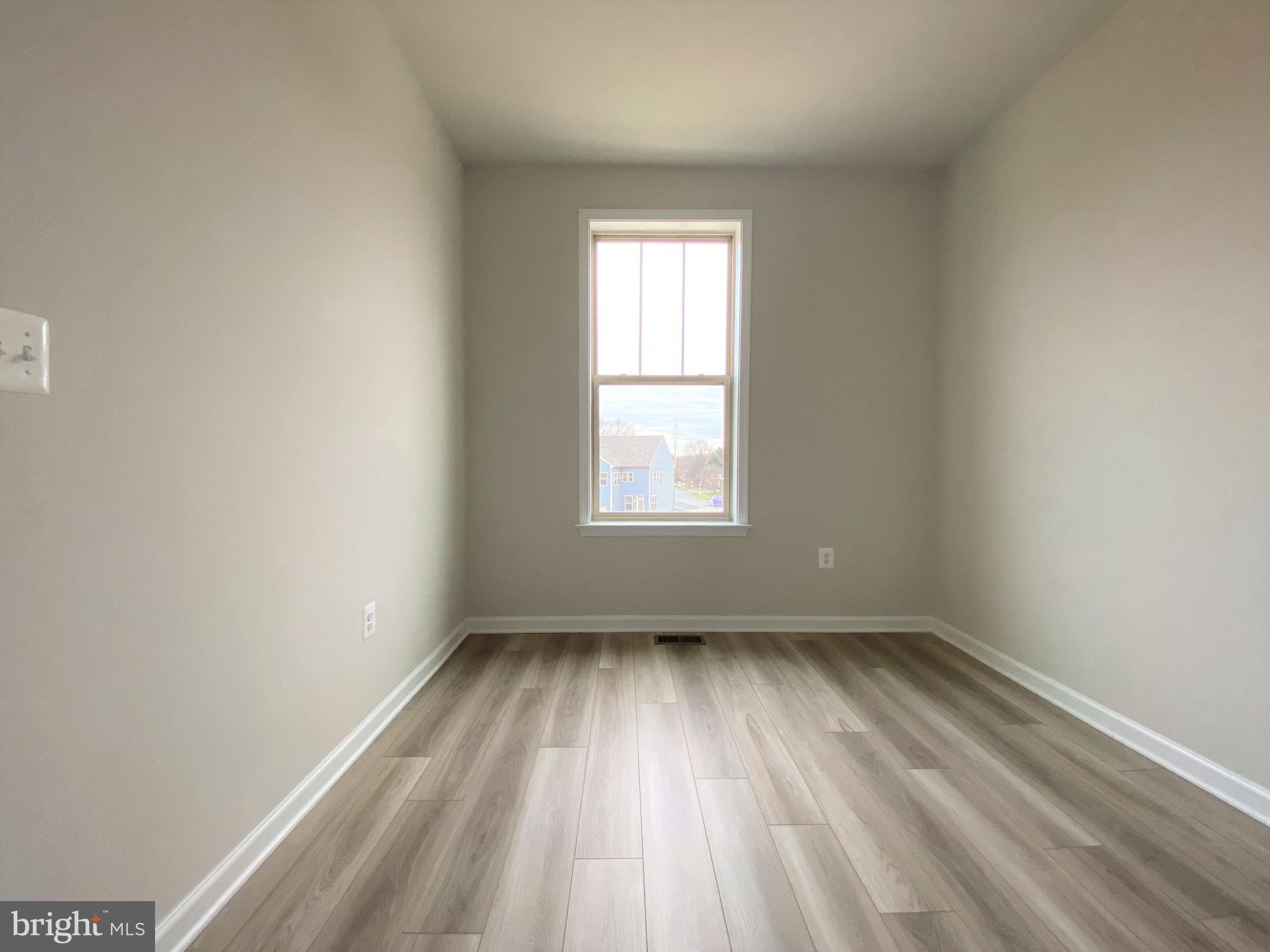 1659 Magundy Street Frederick, MD 21701 - Photo 12 of 16 an empty room with a window