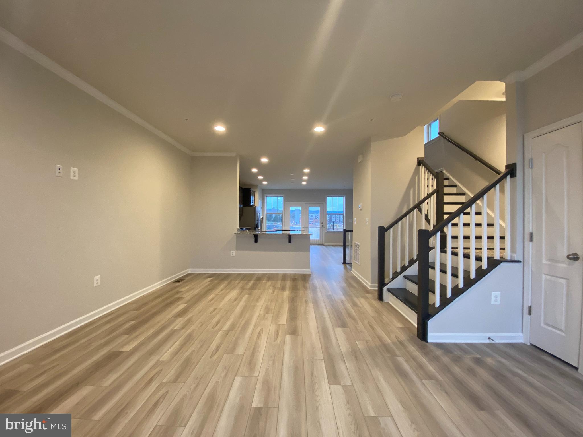 1659 Magundy Street Frederick, MD 21701 - Photo 5 of 16 a view of entryway and hall with wooden floor