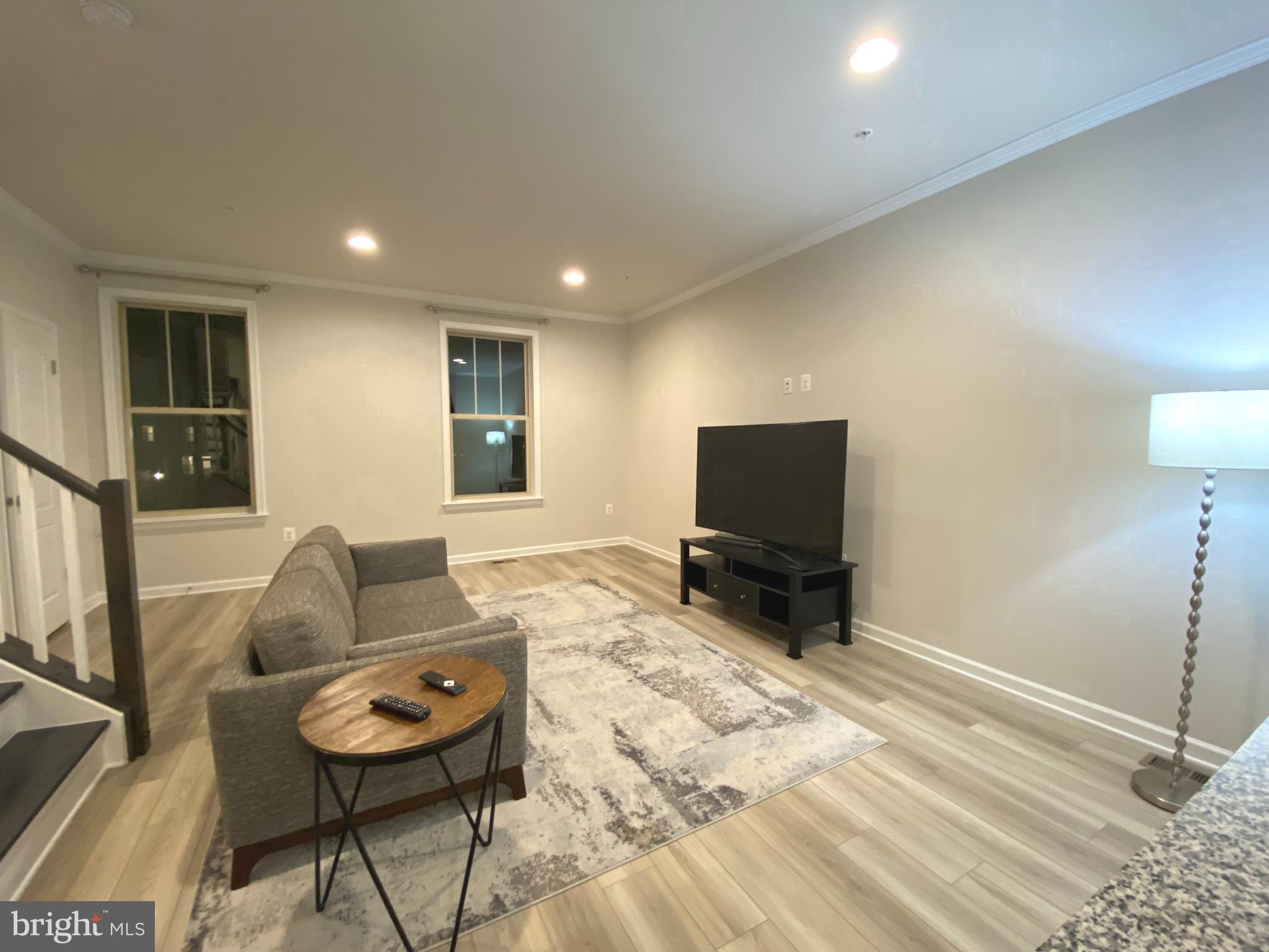 1659 Magundy Street Frederick, MD 21701 - Photo 6 of 16 a living room with furniture and a flat screen tv
