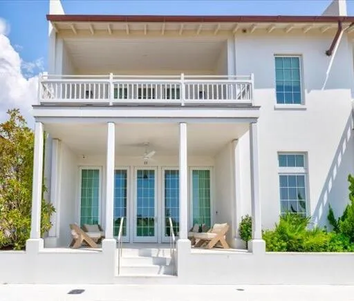 a view of a house with swimming pool and a yard