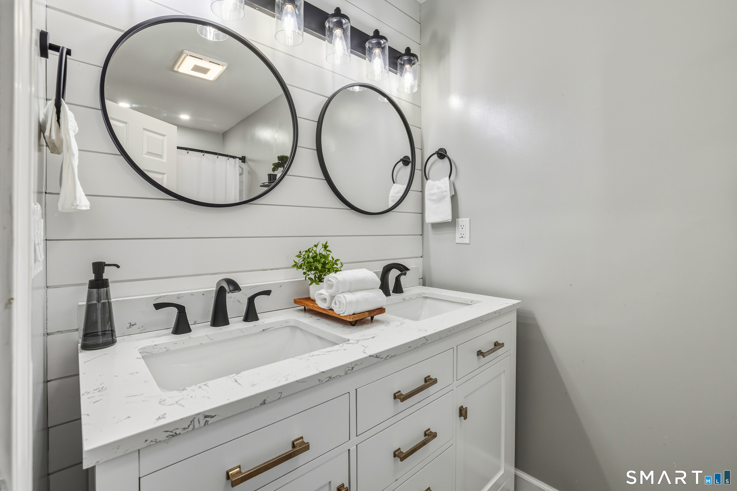 20 Wolf Hill Road, Unit 1A Wolcott, CT 06716 - Photo 20 of 36 Beautifully remodeled primary bath - vanity with dual sinks and quartz countertop and shiplap accent wall