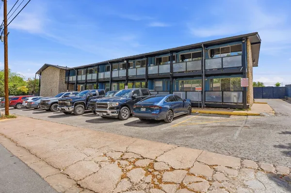 a cars parked in front of a building