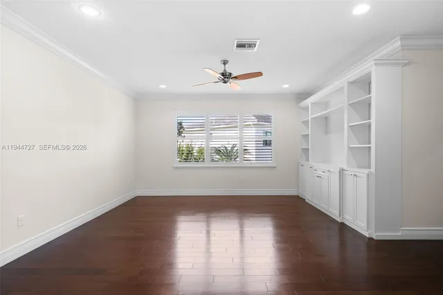 a bathroom with a granite countertop sink a toilet a mirror and shower