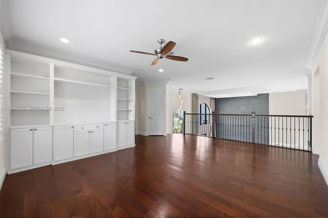 a view of a house with a swimming pool and a yard