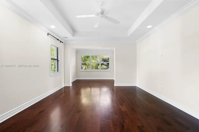 an aerial view of residential houses with outdoor space and swimming pool