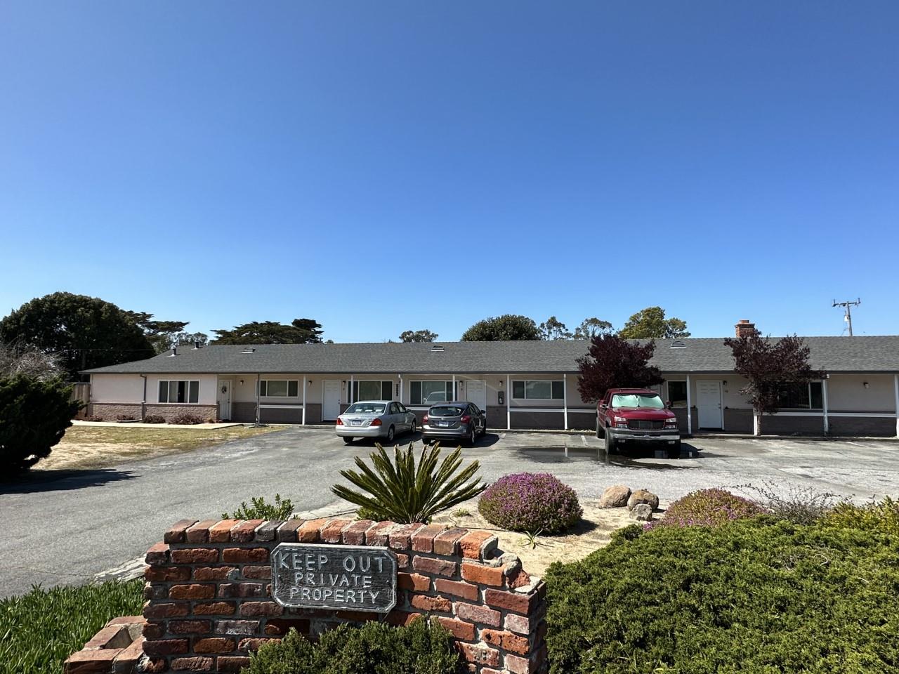 a swimming pool view with a outdoor seating
