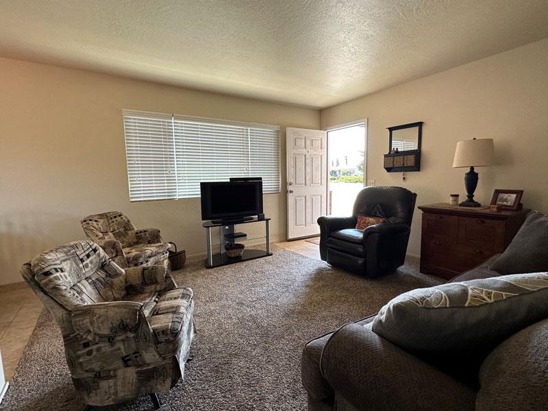 226 Harben Circle Marina, CA 93933 - Photo 10 of 15 a living room with furniture and a flat screen tv