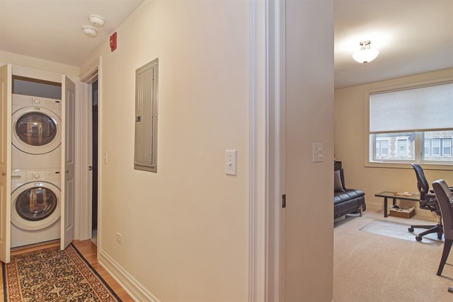 310 South Main Street, Unit 208 Lombard, IL 60148 - Photo 9 of 15 a living room with furniture and a rug