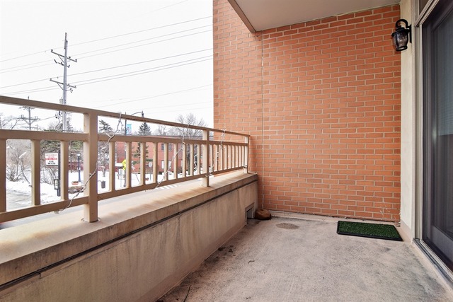 310 South Main Street, Unit 208 Lombard, IL 60148 - Photo 10 of 15 a view of a porch with wooden floor
