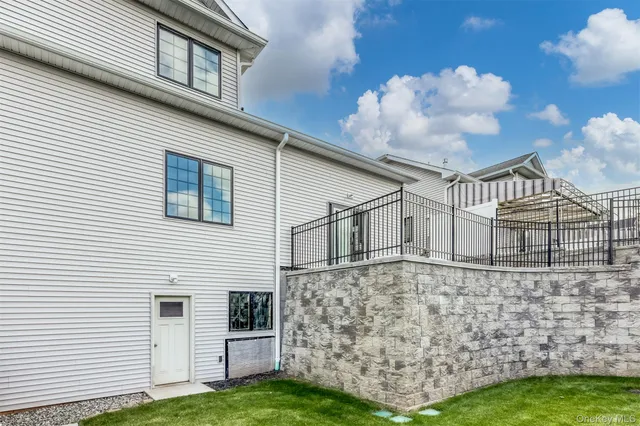 an aerial view of a house with swimming pool outdoor seating and yard
