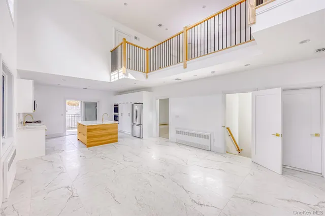 a kitchen with stainless steel appliances a stove a microwave and a refrigerator