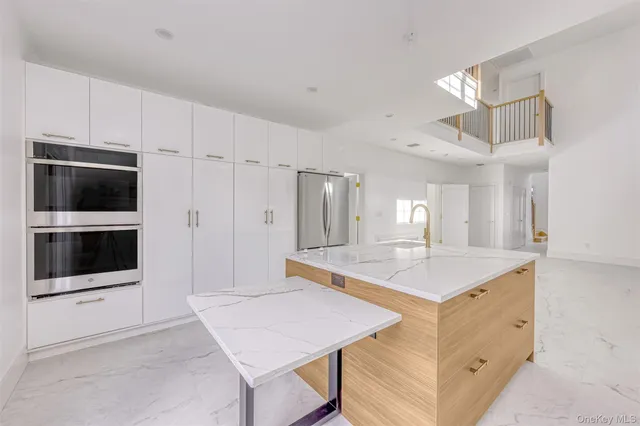 a bathroom with a sink double vanity and a mirror