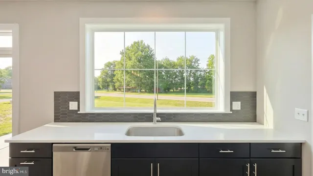 a bathroom with a sink and a window