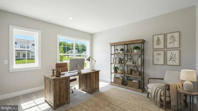 a work room with furniture and windows