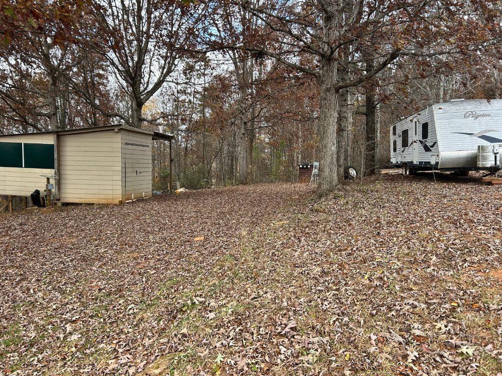 99 Rocket Drive Cleveland, GA 30528 - Photo 6 of 12 a backyard of a house with lots of green space