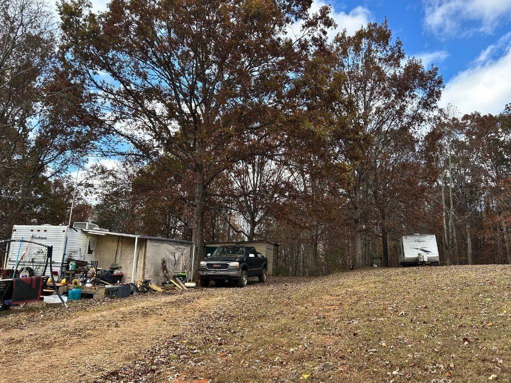 99 Rocket Drive Cleveland, GA 30528 - Photo 10 of 12 a car parked in front of a house