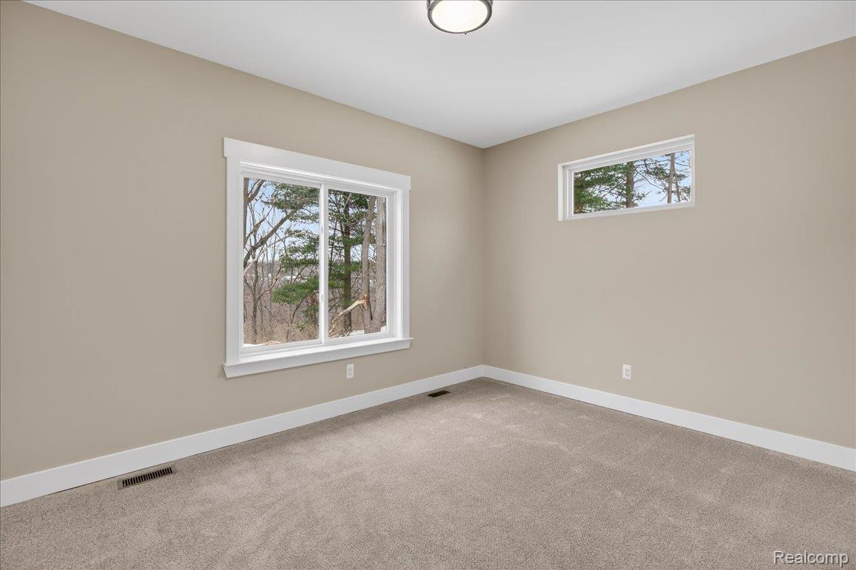 4050 Metamora Ridge Road Metamora, MI 48455 - Photo 52 of 65 Empty room with baseboards and carpet flooring