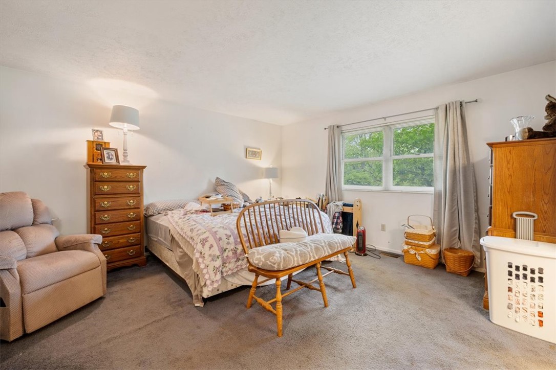 7225 Garber Road Clayton, OH 45415 - Photo 14 of 33 This spacious bedroom offers a tranquil retreat with ample natural light.