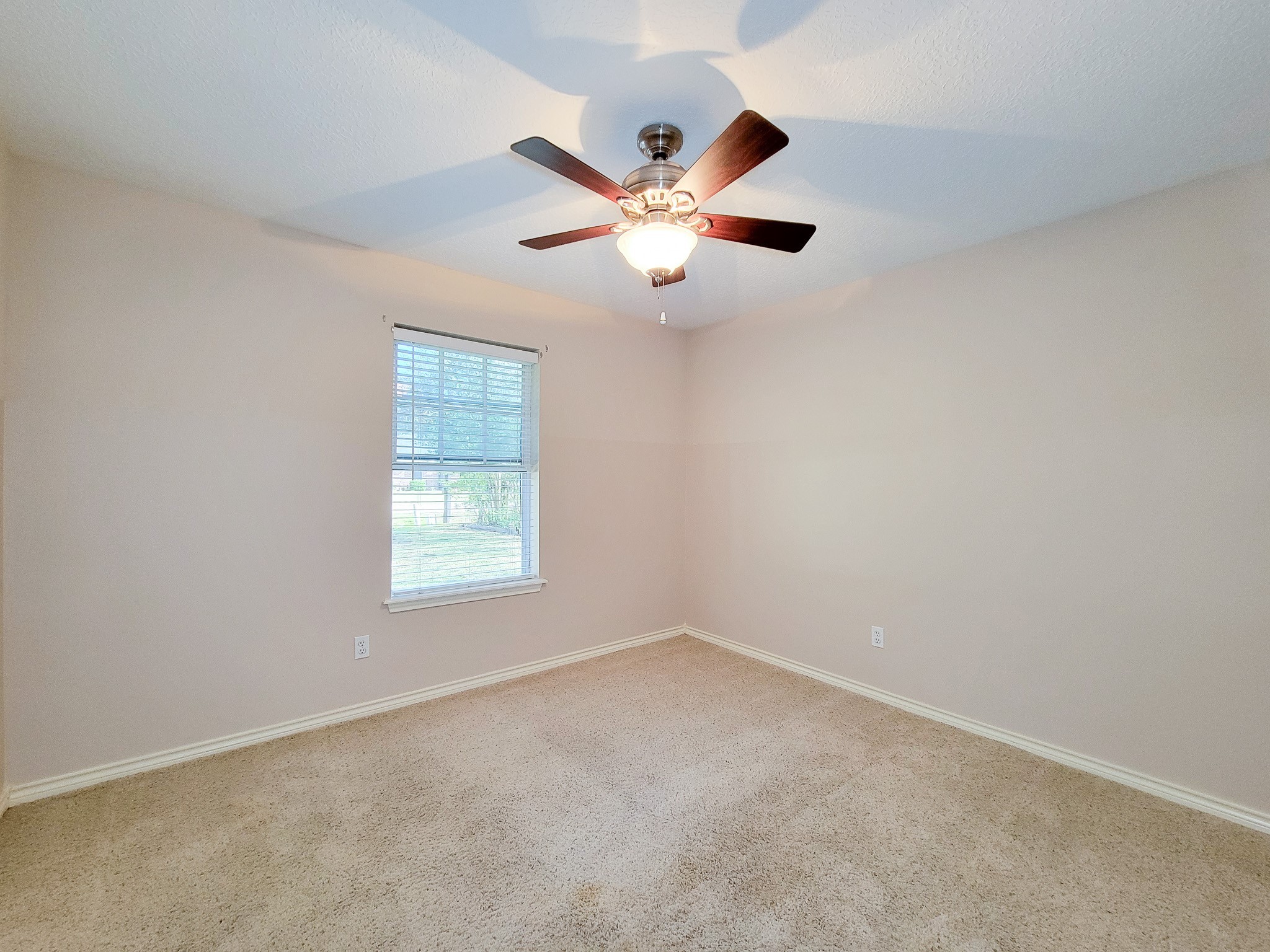 1000 Shell Avenue Cleveland, TX 77327 - Photo 18 of 34 a view of an empty room with a window