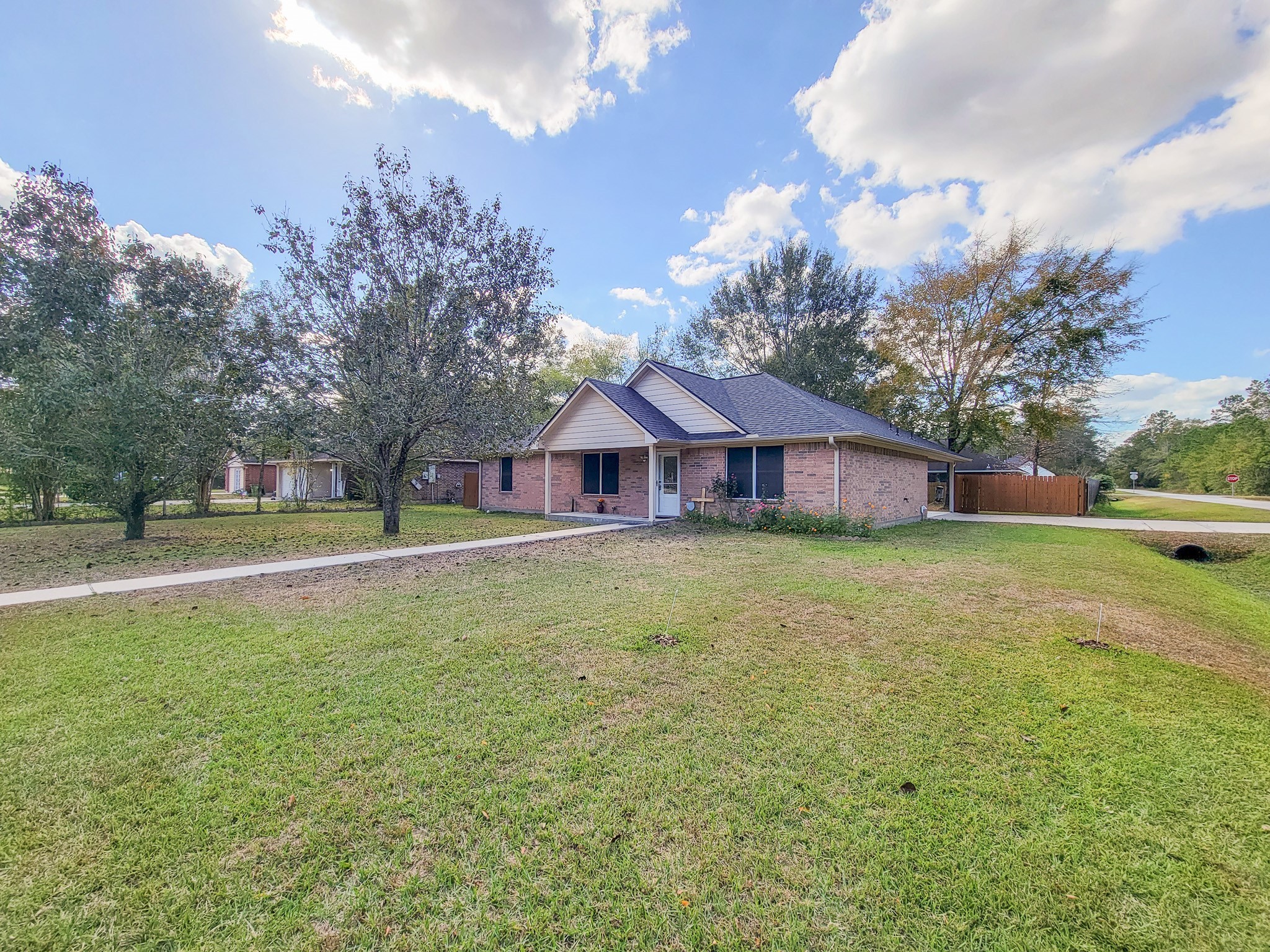 1000 Shell Avenue Cleveland, TX 77327 - Photo 3 of 34 a front view of house with yard and trees in the background