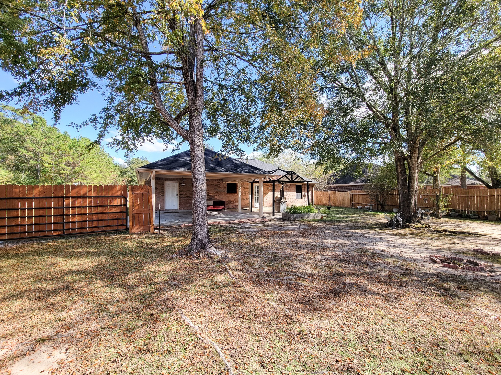 1000 Shell Avenue Cleveland, TX 77327 - Photo 33 of 34 a tree in front of a white house