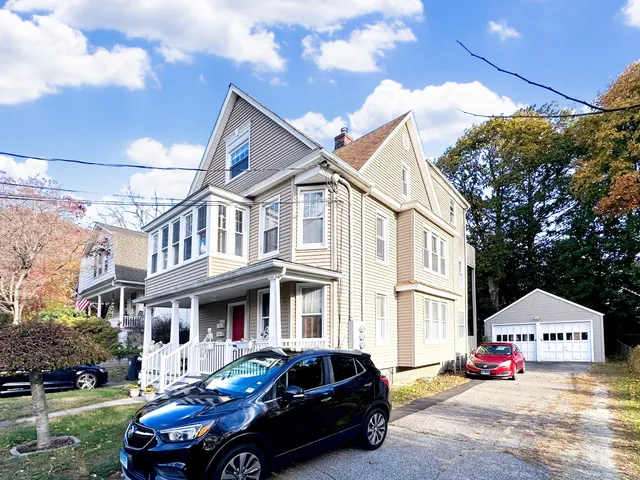 a front view of a houses with yard