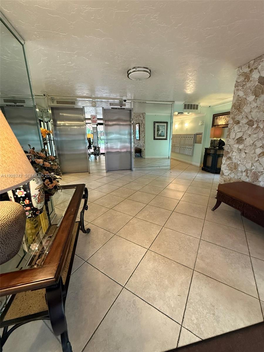 3091 North Course Drive, Unit 705 Pompano Beach, FL 33069 - Photo 5 of 30 a room with lots of storage and utility room