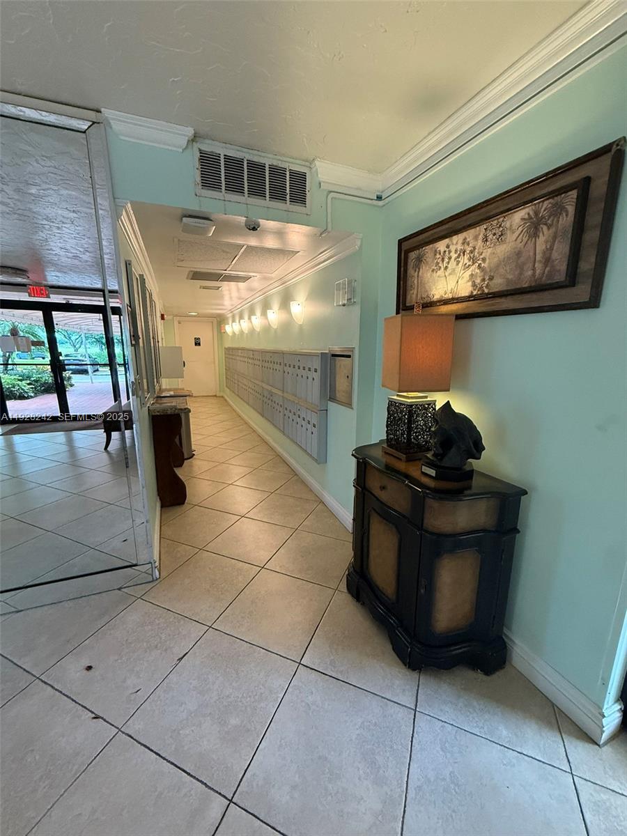 3091 North Course Drive, Unit 705 Pompano Beach, FL 33069 - Photo 7 of 30 a room with gym equipment