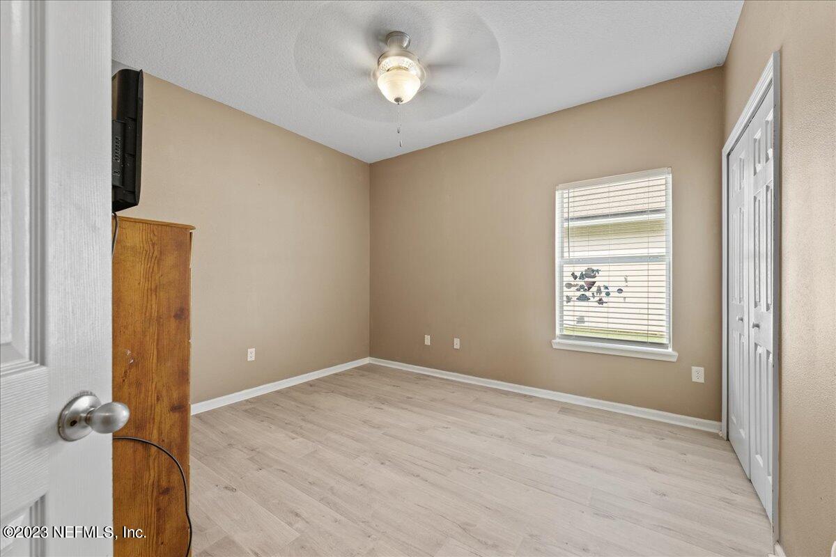 2861 Spoonbill Trail Orange Park, FL 32073 - Photo 12 of 23 a view of an empty room with a window