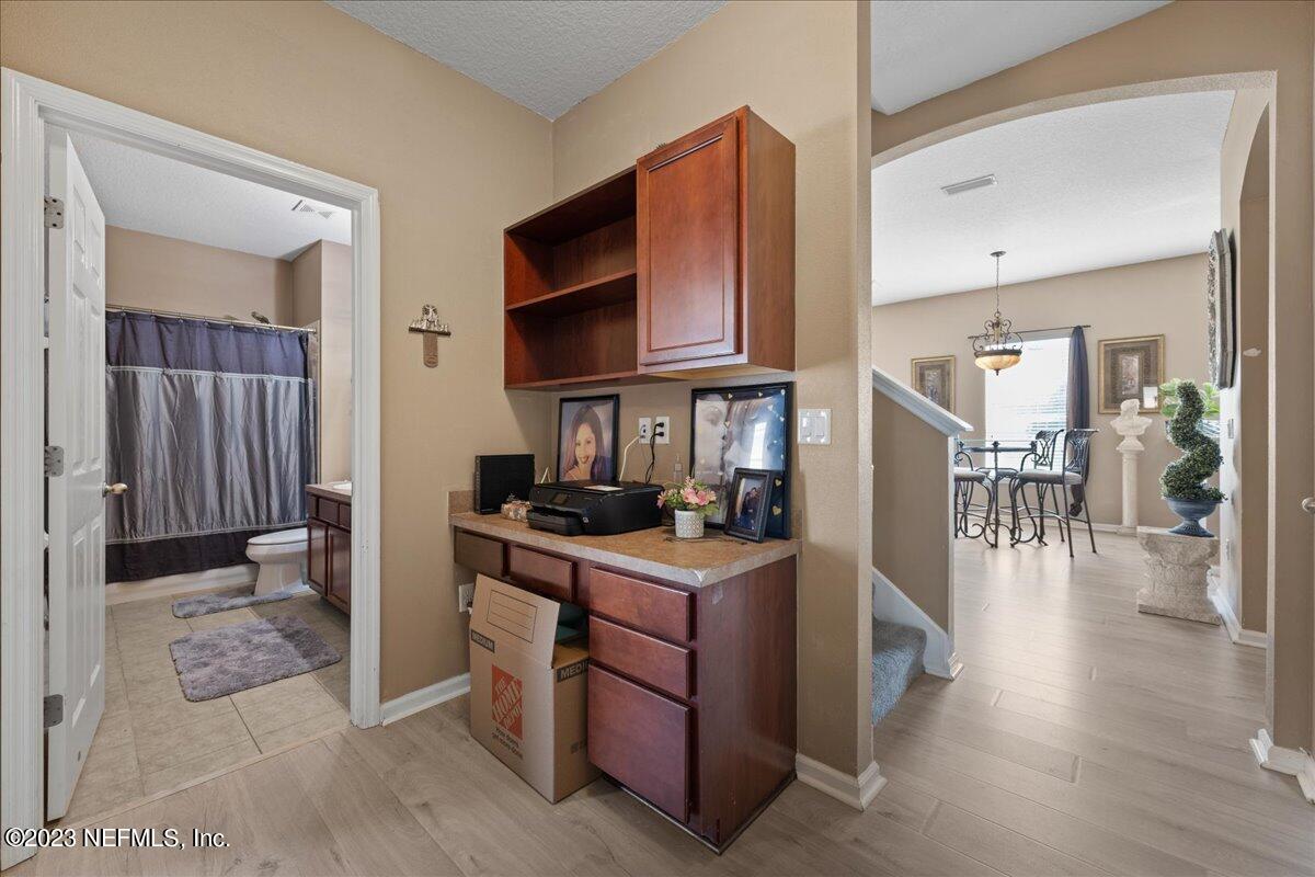2861 Spoonbill Trail Orange Park, FL 32073 - Photo 13 of 23 a kitchen with stainless steel appliances granite countertop a stove a sink and a refrigerator
