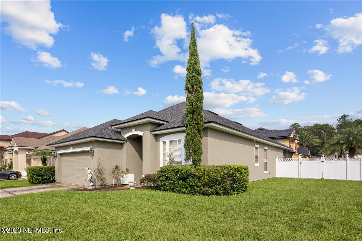 2861 Spoonbill Trail Orange Park, FL 32073 - Photo 2 of 23 a front view of a house with a yard