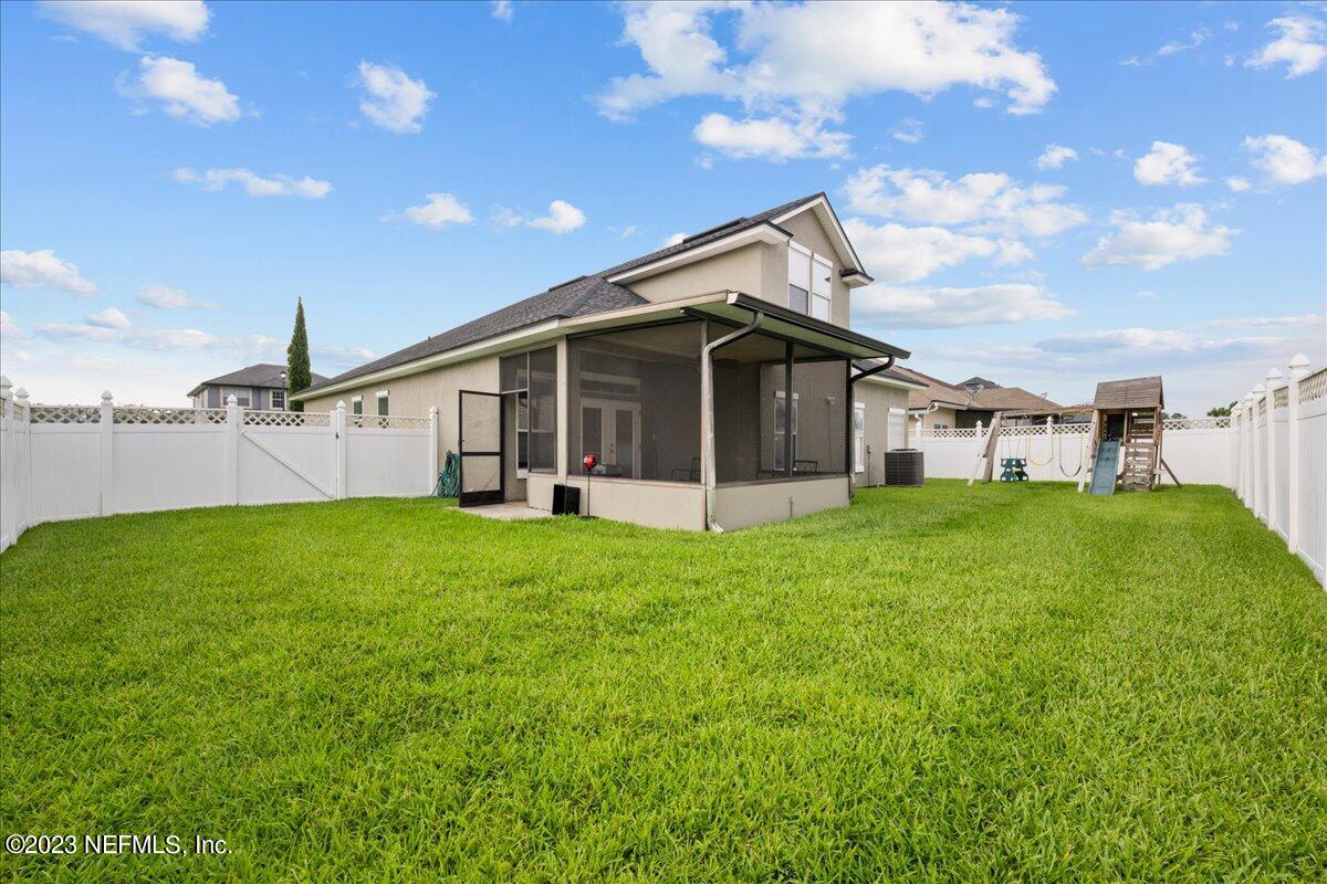 2861 Spoonbill Trail Orange Park, FL 32073 - Photo 21 of 23 a view of a house with backyard