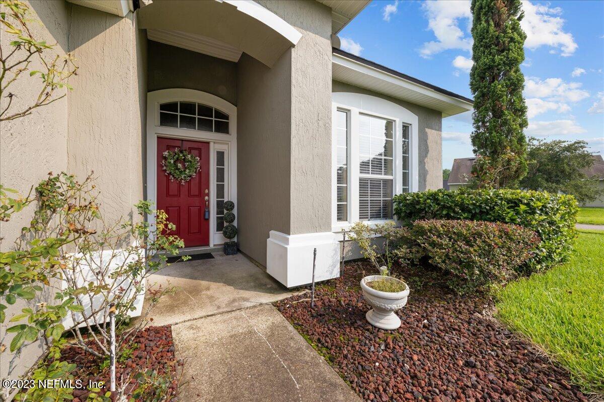 2861 Spoonbill Trail Orange Park, FL 32073 - Photo 4 of 23 a front view of a house with garden
