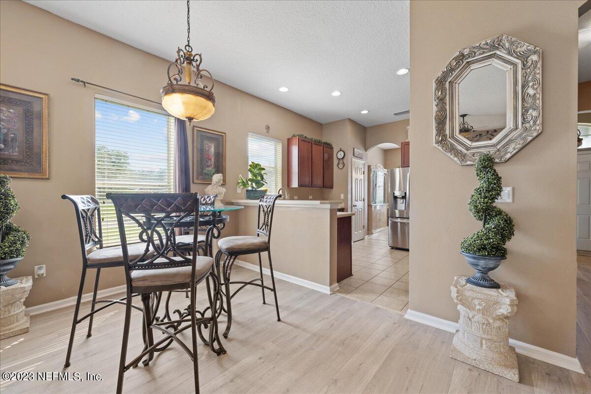 2861 Spoonbill Trail Orange Park, FL 32073 - Photo 8 of 23 a view of a dining room with furniture window and wooden floor