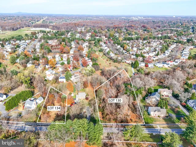 an aerial view of residential houses and outdoor space