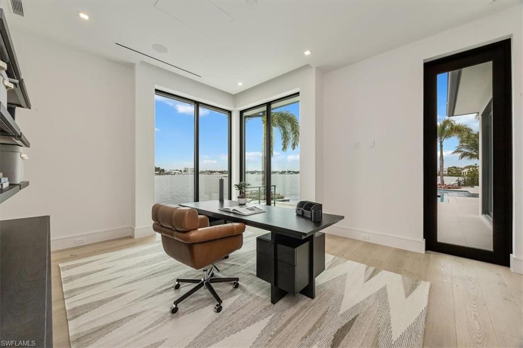1640 Dolphin Court Naples, FL 34102 - Photo 13 of 45 a living room with furniture and a window